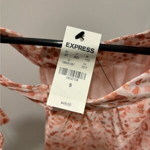 Never worn. No longer fits